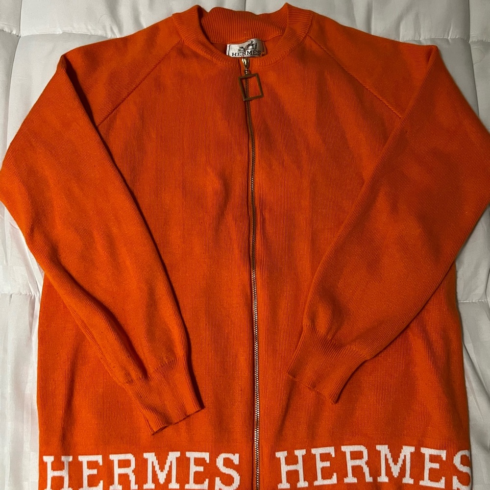 Beautiful women’s Orange sweater with a full zipper.